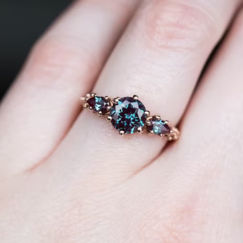 The Ursula round alexandrite three stone ring