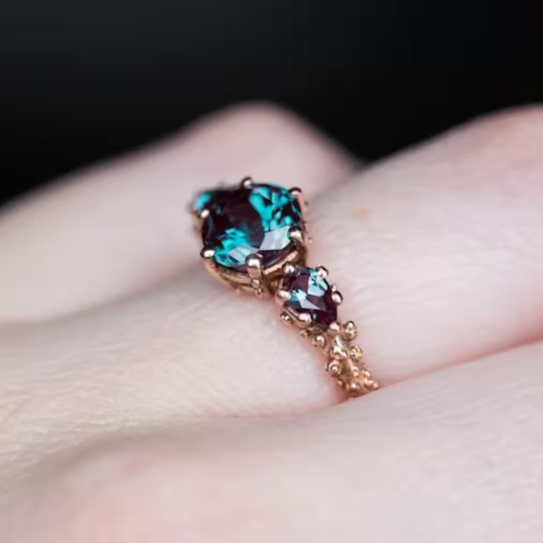 The Ursula round alexandrite three stone ring