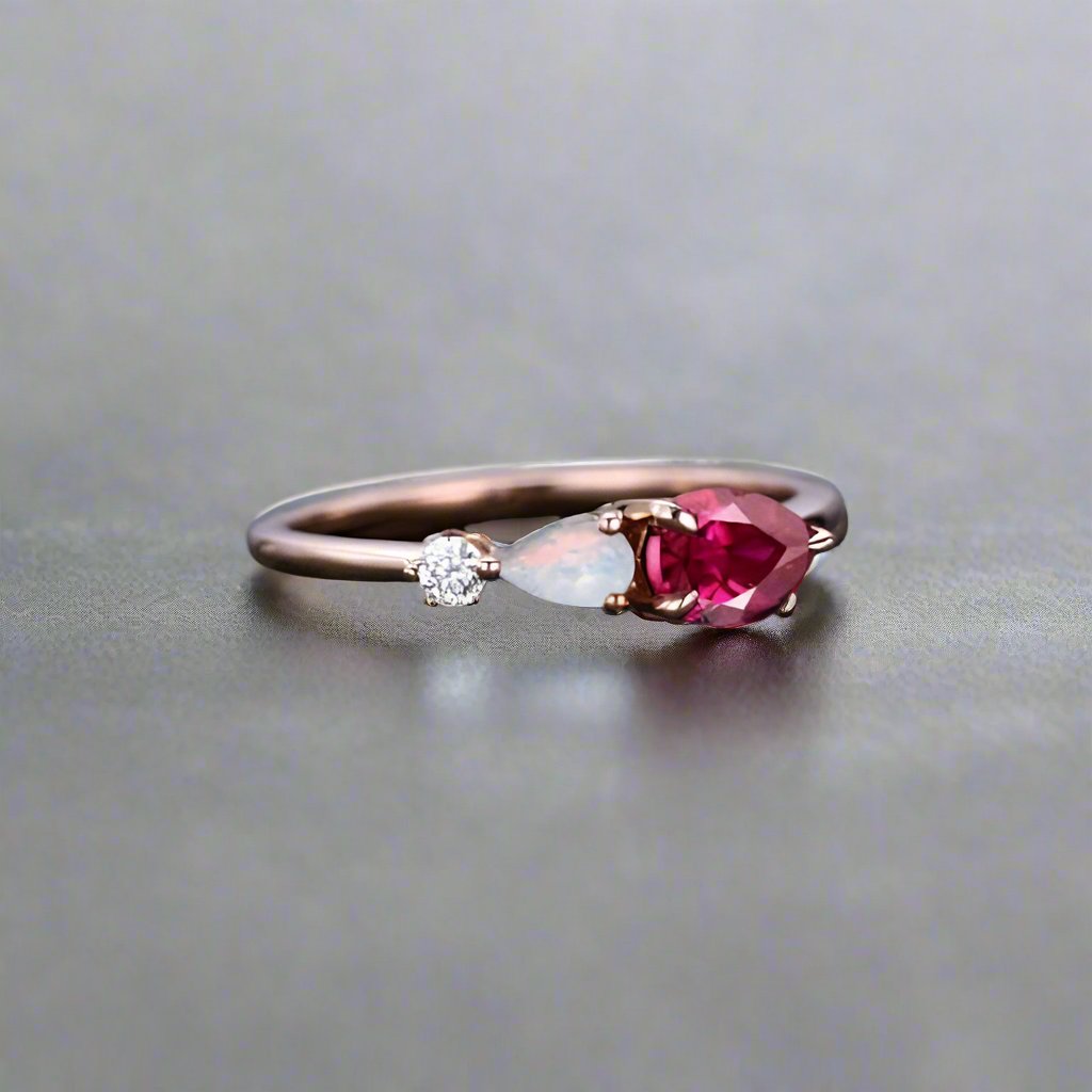 Ruby stone ring featuring two opal and diamonds, elegantly designed for a sophisticated look.