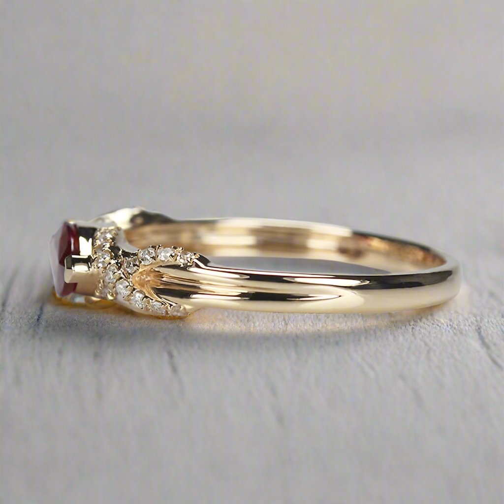 a stunning design featuring a 0.45ct marquise-cut ruby set horizontally on a sleek 14K gold band, available in rose, white, or yellow gold. The ring is accented with 0.10ct of sparkling moissanite side stones, showcasing timeless elegance and modern style. Perfect for stacking or as a standalone statement piece.