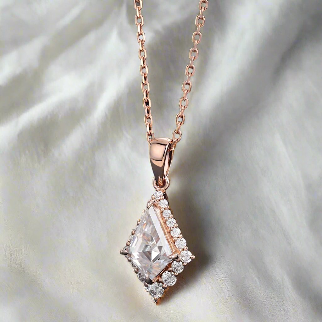 &quot;Delta Halo pendant with a 6x9mm kite-shaped lab-grown diamond center stone, framed by a halo of smaller lab-grown diamonds. The pendant combines geometric elegance with sustainable luxury for a captivating, modern look.&quot;