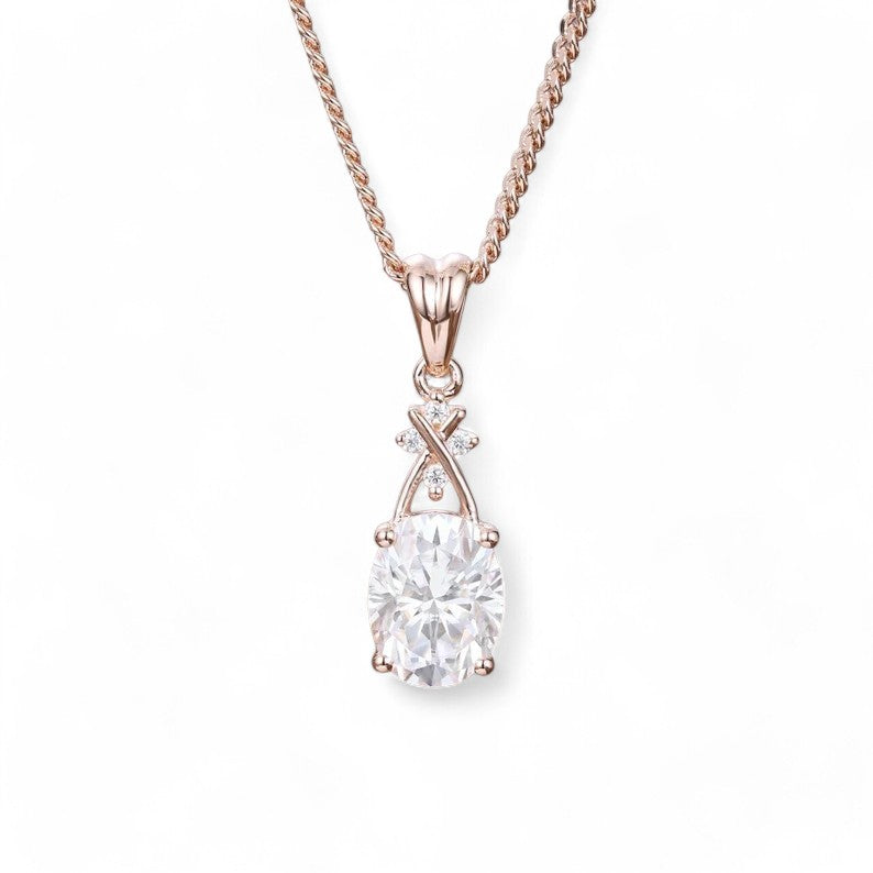 &quot;Elegant pendant with a 6x8mm oval lab-grown diamond centerpiece, known for its brilliance and eco-friendly appeal. Features 0.02CT lab-grown diamond accents for added sparkle. Paired with a 1mm gold chain, available up to 24 inches in length.&quot;








