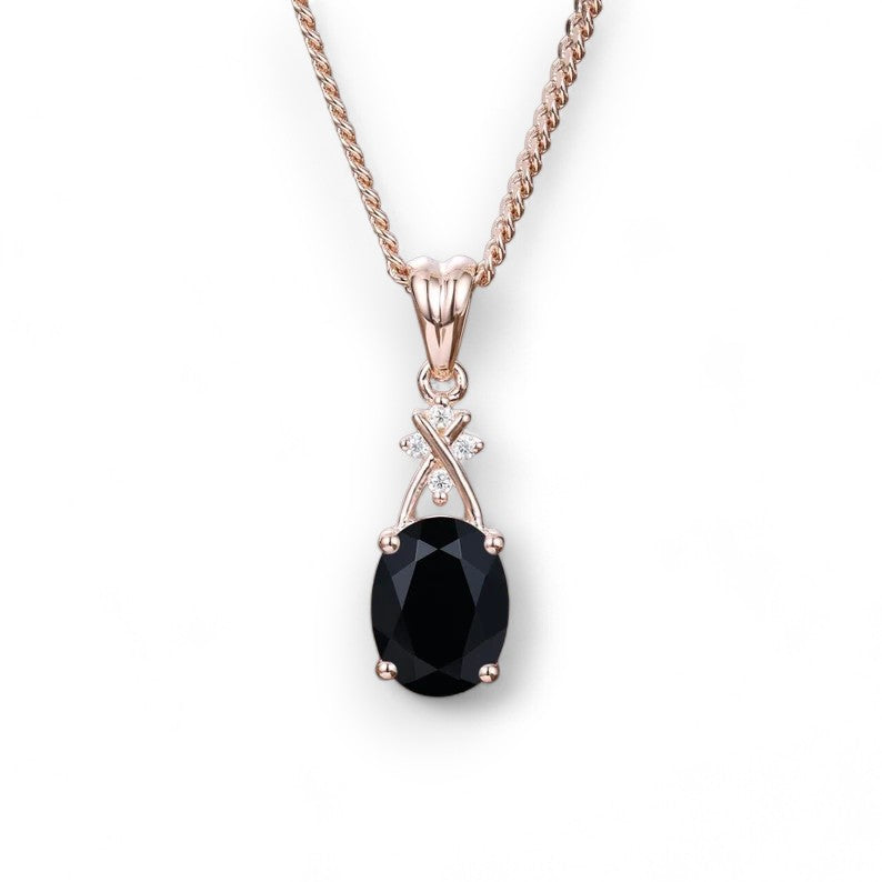 elegant pendant with 6x8mm oval-cut black onyx centerpiece and 0.02CT lab-grown diamond accents, set on a 1mm gold chain up to 24 inches long