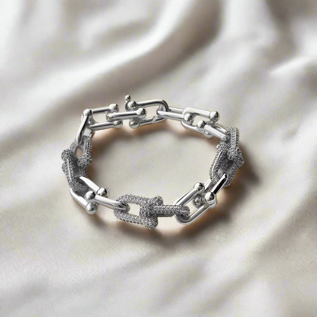 Elegant 18 cm Upsilon Legacy bracelet featuring brilliant Moissanite gemstones, symbolizing the timeless journey of the letter 'U' through history, with sparkling light and modern sophistication.